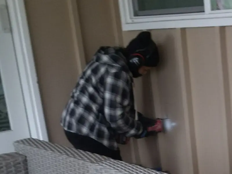 Professional electrician installing an exterior outlet in Dillon