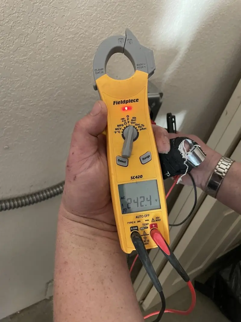 Voltage testing with clamp meter during Ceiling Fan Installation in Dillon